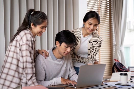 The trio sharing ideas and assisting each other with school projects, fostering a sense of learning and camaraderie.