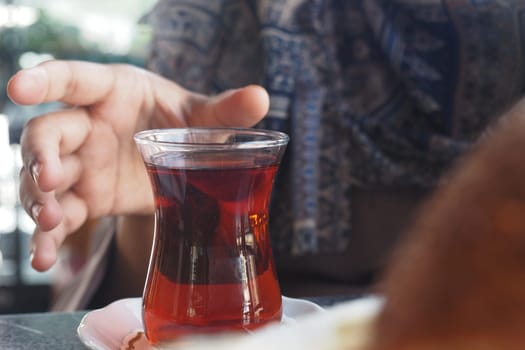 Enjoying traditional turkish tea t a local cafe during afternoon hours.