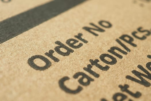 Close-up view of delivery order information printed on a carton.