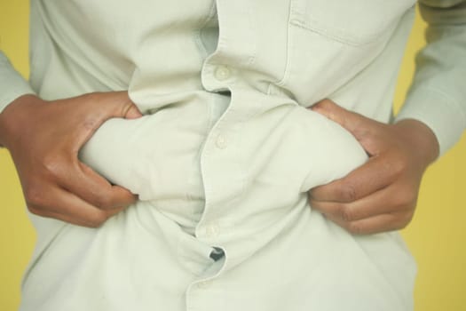hand gripping excessive belly fat ,
