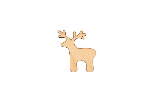 Wooden flat blank in the form of a deer figure on a white isolated background. Flat lay, top view