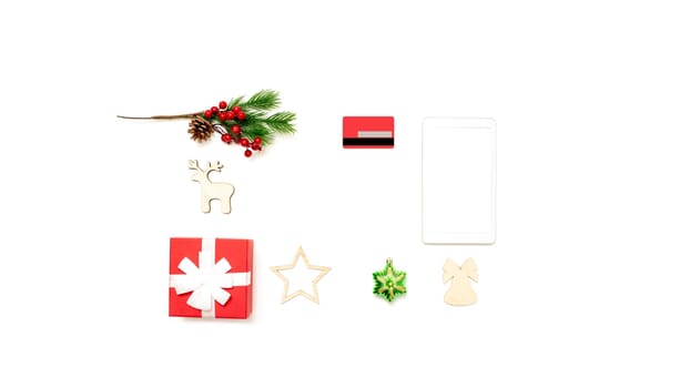 Wide banner with digital tablet with copy space on top on white table, credit card, gift box and christmas toys. Online shopping concept in christmas. Mock up. Copy space.Top view