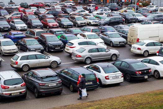 Belarus, Minsk - 02.01.2025: In a busy parking lot, numerous cars are parked, but among them, there is one specific car that has a license plate beginning with the letter k