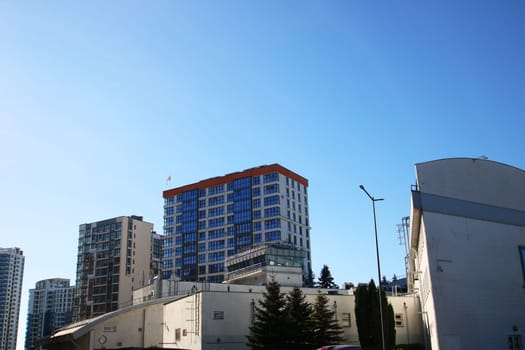 Belarus, Minsk - 04, 01,2025:A remarkably tall and impressive building rises against a clear blue sky in the background, creating a striking urban scene