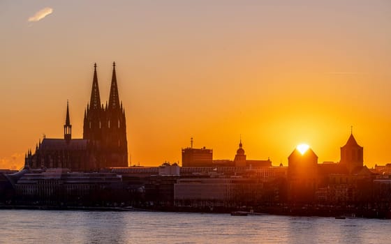 Cologne, Germany - January 13, 2025: Cathedral of Cologne against sunset on January 13, 2025 in Germany, Europe