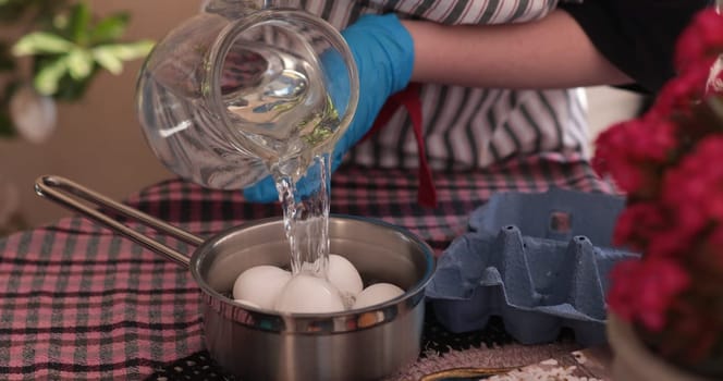 Eggs are being prepared for boiling to create beautiful Easter eggs for decorating and coloring. This festive activity is a beloved tradition during the holiday.