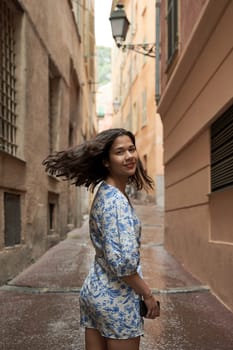 Beautiful young mixed race woman in the old town of Nice