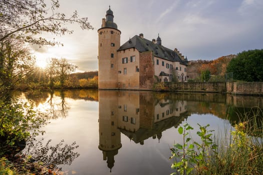 Mechernich, Germany - November 22, 2023: Panoramic image of old Veynau castle during evening on November 22, 2023 in Eifel, North Rhine Westphalia, Germany