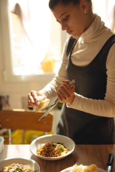 A talented woman prepares a gourmet pasta dish, showcasing her culinary creativity and passion for cooking
