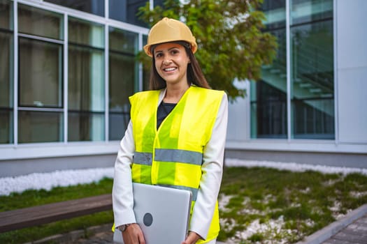 Smiling female safety engineer outdoors.