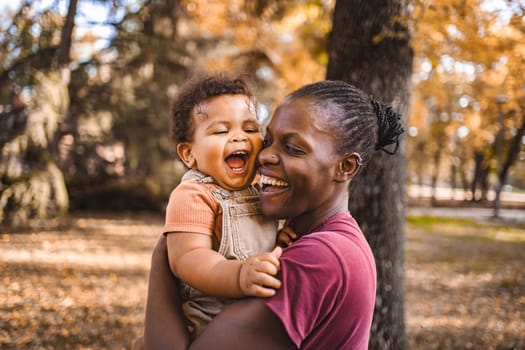 Mother's Embrace: Joyful Moments in the Park.