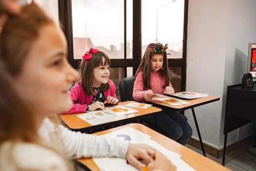 Female group of elementary students together at language school.
