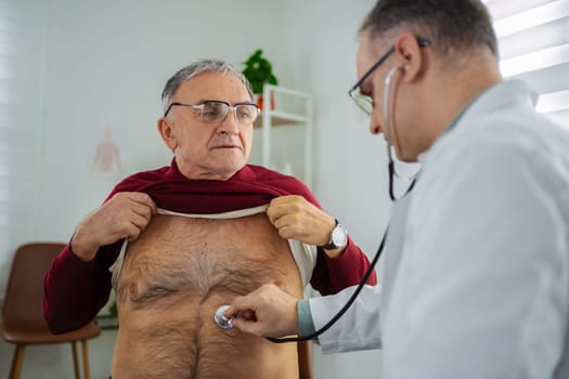 Doctor conducts a health examination for an elderly patient.