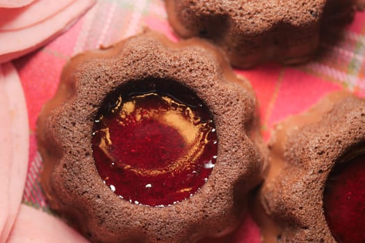 Sweets feature chocolate texture with vibrant jelly center on fabric.