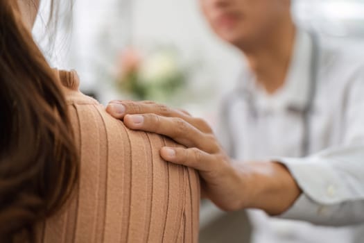 In a warm and supportive environment, a doctor offers comfort to a patient, demonstrating the importance of empathy and human connection in healthcare.