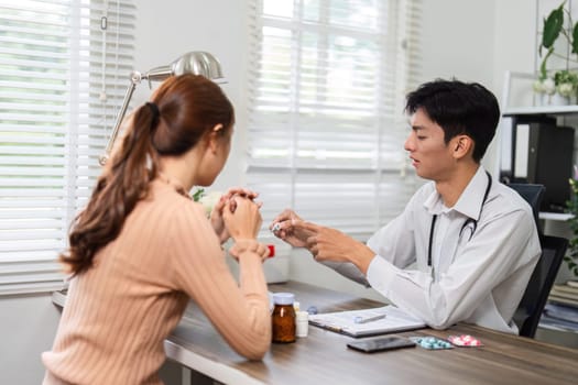 A healthcare professional attentively discusses medication options with a woman during a private consultation, ensuring her understanding and comfort.