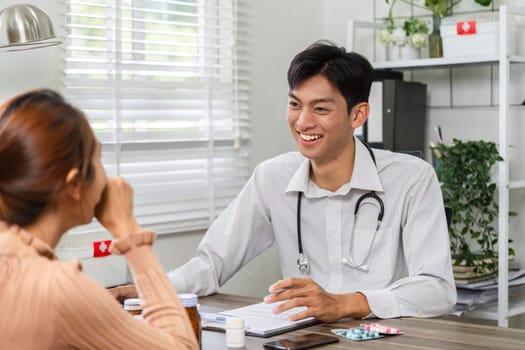 A doctor engages in a friendly conversation with a patient, discussing health concerns and providing personalized care in a welcoming clinic environment.
