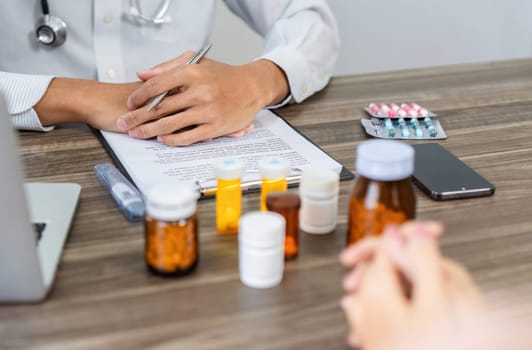 An attentive healthcare provider discusses various medications and treatment plans, focusing on patient needs and collaborative health strategies for effective outcomes.