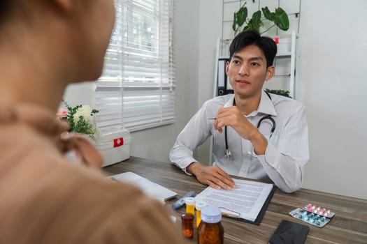 In a professional environment, a doctor reviews medication options with a patient, emphasizing the importance of informed choices in health management and treatment.