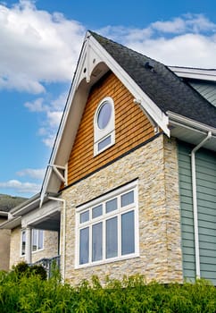 Front side of residential house on cloudy sky background in Canada.