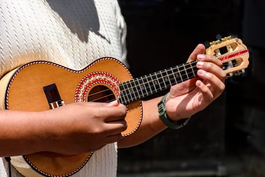 Cavaquinho being played during a samba performance on the streets of Brazil