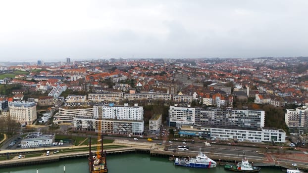 Boulogne. France 03.28.2025 Overcast aerial panorama of Boulogne-sur-Mer featuring residential neighborhoods, harborfront buildings, and red-tiled rooftops in northern France.