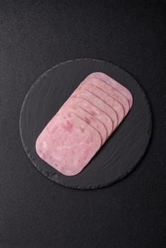 Eating ham and pork slices for the holiday table. Spiced ham sliced for breakfast sandwiches