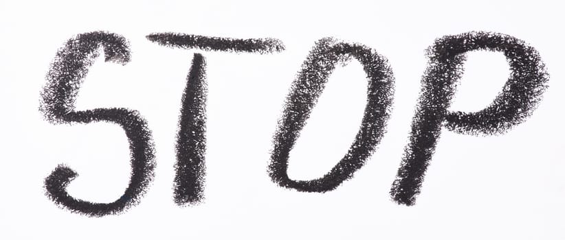 Word STOP is written in bold black pencil on white paper in a hand drawn, textured style, emphasizing urgency or a warning message.