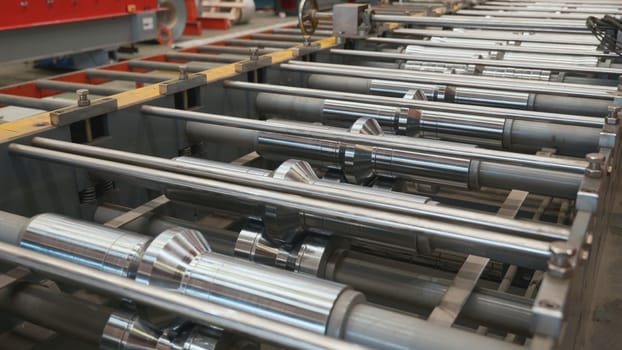 Steel roofing forming machine for manufacturing metal pipes and tubes in the factory, Industrial machine for metel sheet roof coils cut
