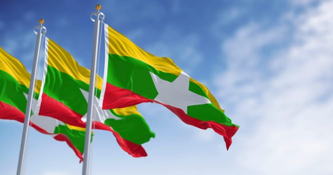High-resolution 3D render of three Burmese flags fluttering in the sky. Symbol of national pride, freedom, and identity in Southeast Asia. Ideal for editorial and geopolitical content