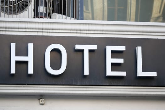 Large hotel sign displayed prominently on the facade of a building.