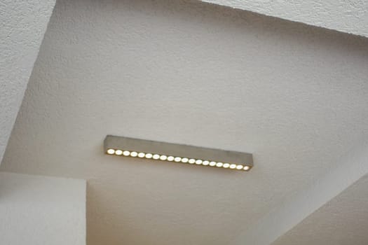 Bright LED light fixture enhances the aesthetic of a clean, simple space.