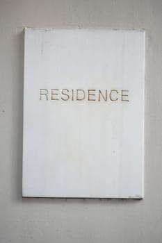 Simple white plaque with the word residence displayed prominently.