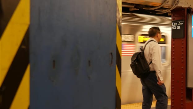 New York City, United States - 30 Aug 2023: Subway station, underground metropolitan platform sign. Metro train, railway public transport. Text signboard: Lexington Avenue. Lex Av. Midtown Manhattan.