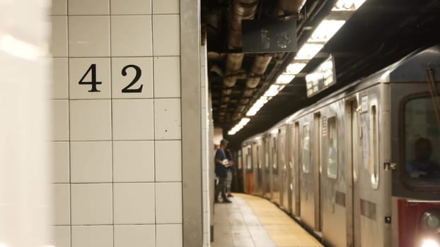 New York City, United States - 29 Aug 2023: Subway station interior, underground metropolitan platform sign. Metro railway train, passenger transport. Text 42 street. Grand Central Terminal, Manhattan