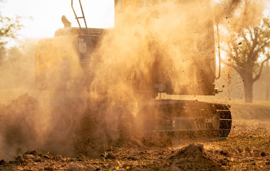 Hydraulic excavator operating at a worksite, moving earth and preparing the foundation for a major construction project. Heavy equipment plays a key role in engineering, roadwork, and excavation.