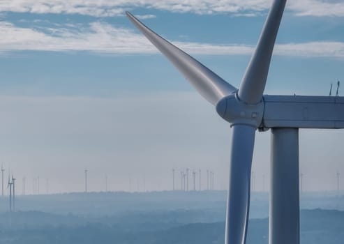 Wind energy. Wind power. Sustainable, renewable energy. Wind turbines generate electricity. Wind farm. Sustainable resources. Sustainable development. Green technology for energy sustainability.