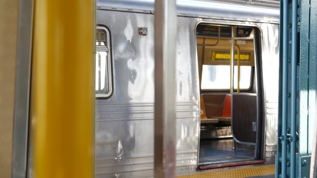 New York City, United States - 2 Sept 2023: Subway train, inside metropolitan wagon. Metro transport, NYC passenger transportation, public underground railway. Railroad traffic. Empty station platform