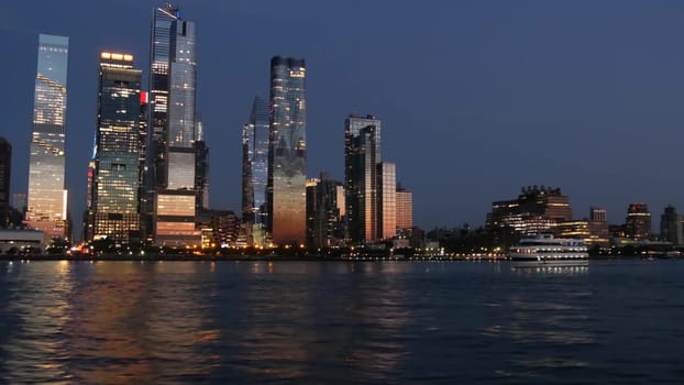 New York City, United States - 4 Sept 2023: Manhattan Midtown skyline from river ferry boat. Hudson Yards skyscrapers from ferryboat. Waterfront panorama riverfront architecture. Empire State Building