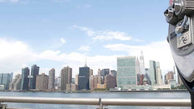 New York City, United States - 4 Sept 2023: Waterfront skyline, Manhattan Midtown, United Nations UN building riverfront skyscraper. Waterside cityscape, tower viewer, Long Island Gantry Plaza, Queens