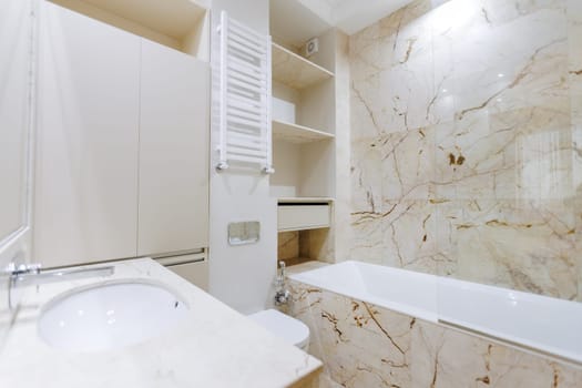 A bathroom that features essential fixtures such as a sink, a toilet, and a bathtub, providing both functionality and comfort