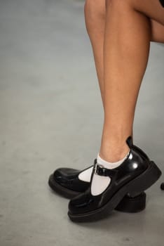 Shiny Black Patent Leather Loafers Side View Classic and Elegant Footwear for Women.