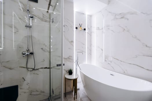 A welldesigned bathroom that includes both a relaxing bathtub and a separate shower stall for enhanced functionality and comfort