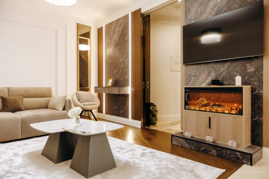 Imagine a cozy living room that features a warm fireplace along with a sleek, modern flat screen television mounted on the wall