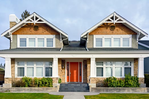 A perfect neighbourhood. Luxury family house with nicely landscaped front yard and concrete pathway to the entrance