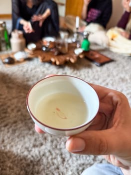 Moment of connection through tea during traditional ceremony. Mindfulness, ritual and shared presence as part of the tea culture experience.
