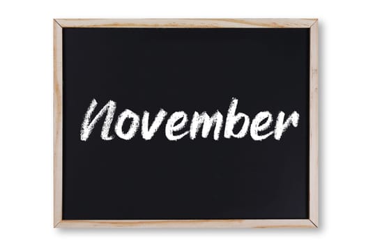 A November word in chalk on chalkboard with clipping path to remove shadow