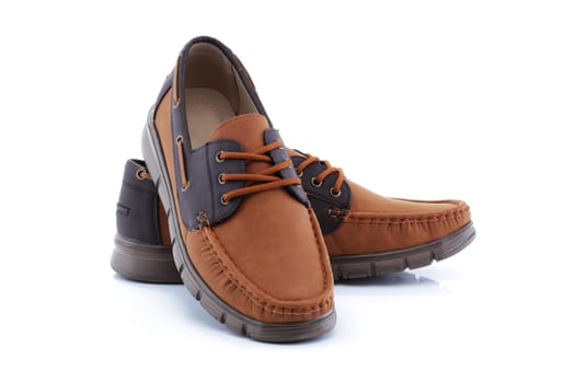 A pair of mens brown shoes loafers