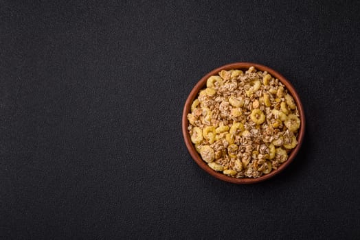 Flakes, chocolate balls and dried fruit for a hearty breakfast. Granola with chocolate flakes