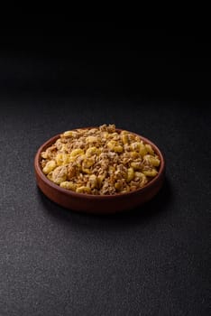 Flakes, chocolate balls and dried fruit for a hearty breakfast. Granola with chocolate flakes
